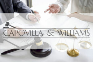 attorney sitting at table discussing legal matters attorney sitting at table discussing legal matters