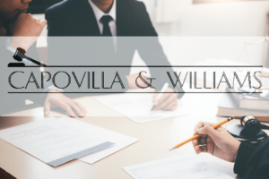 Attorney across from client sitting at desk Attorney across from client sitting at desk