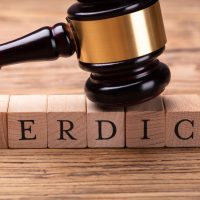 Gavel Over Wooden Blocks With Text Verdict Gavel Over Wooden Blocks With Text Verdict